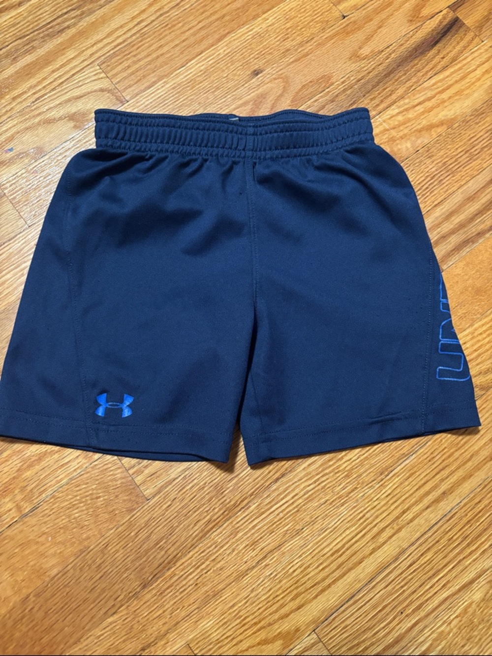 Under Armour Black Shorts with Blue Logo and Side Lettering